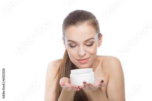 Woman with a moisturizer or body treatment