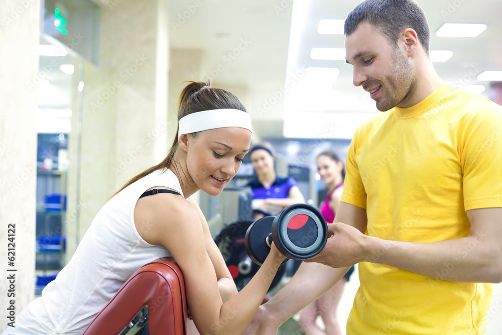 woman with instructor in gym