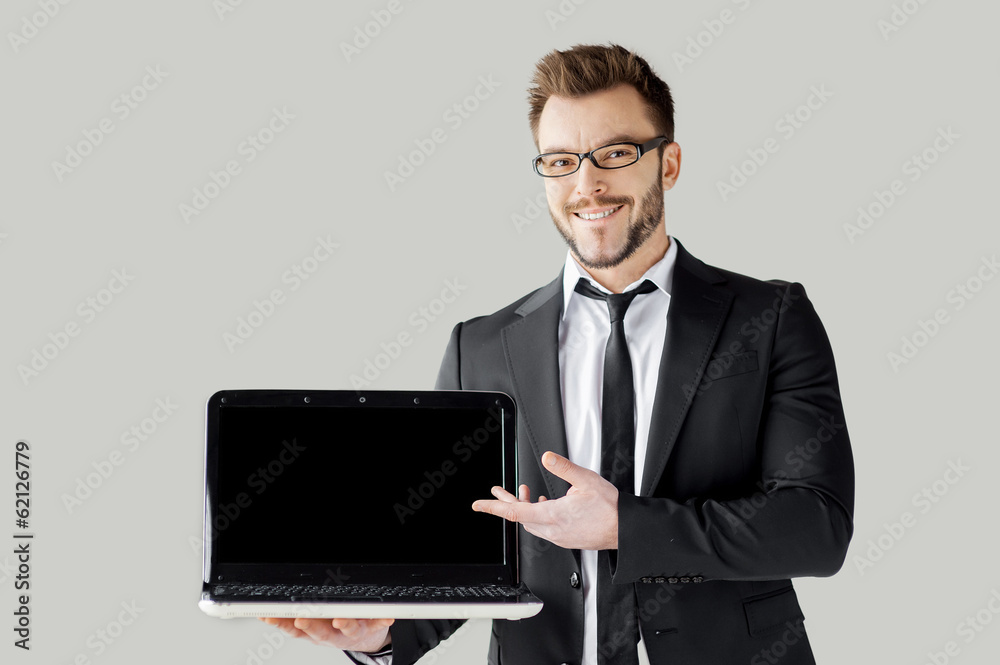 Pointing copy space on his laptop. Pointing copy space on his laptop.