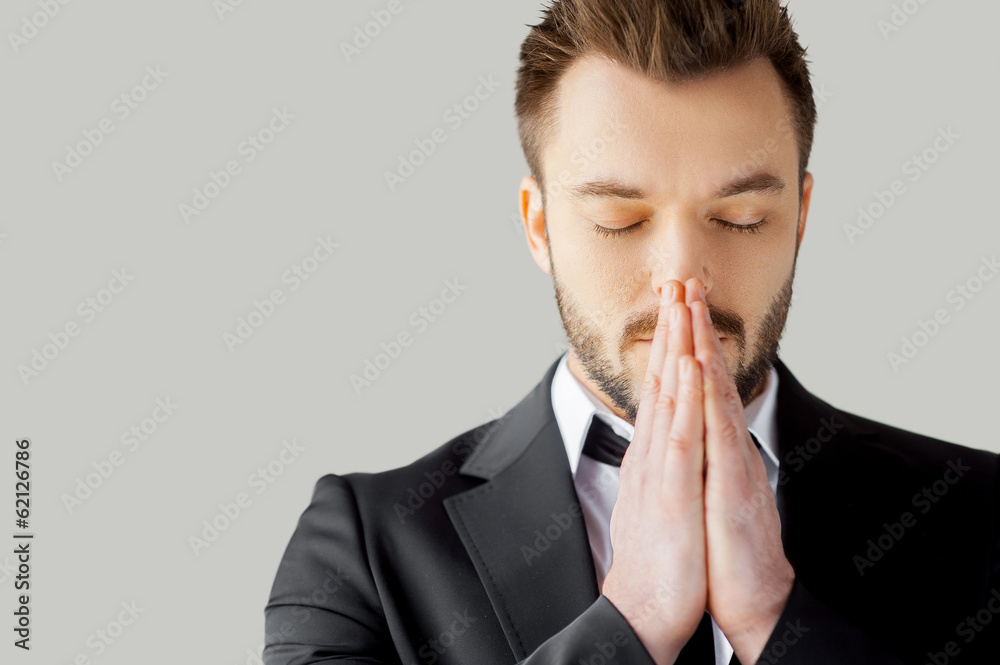 Businessman praying. Businessman praying.