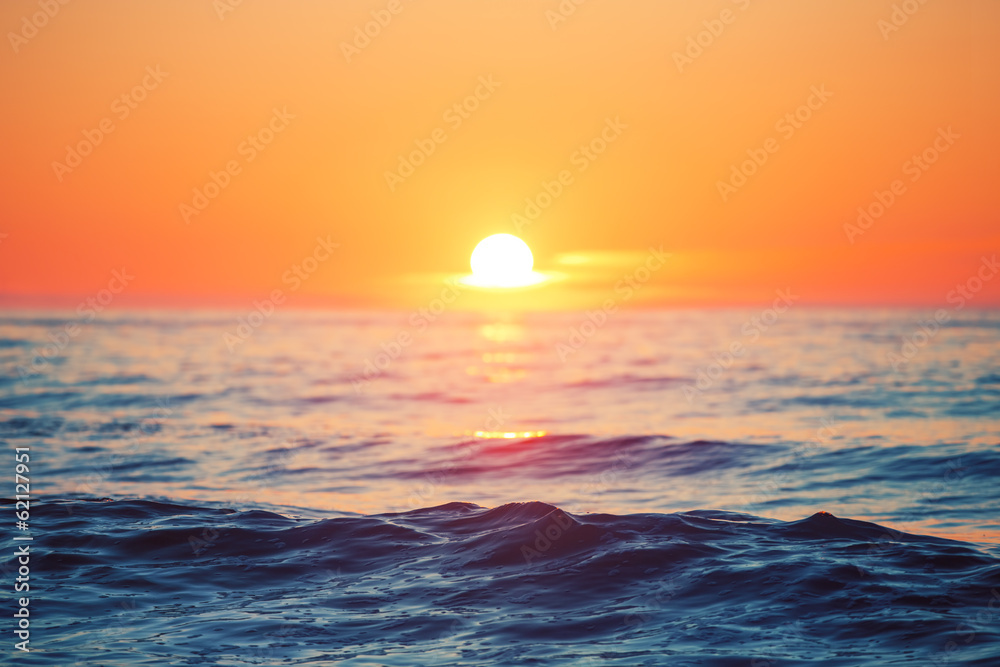 Sunrise and sea waves