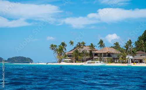 Villa on white sand tropical beach