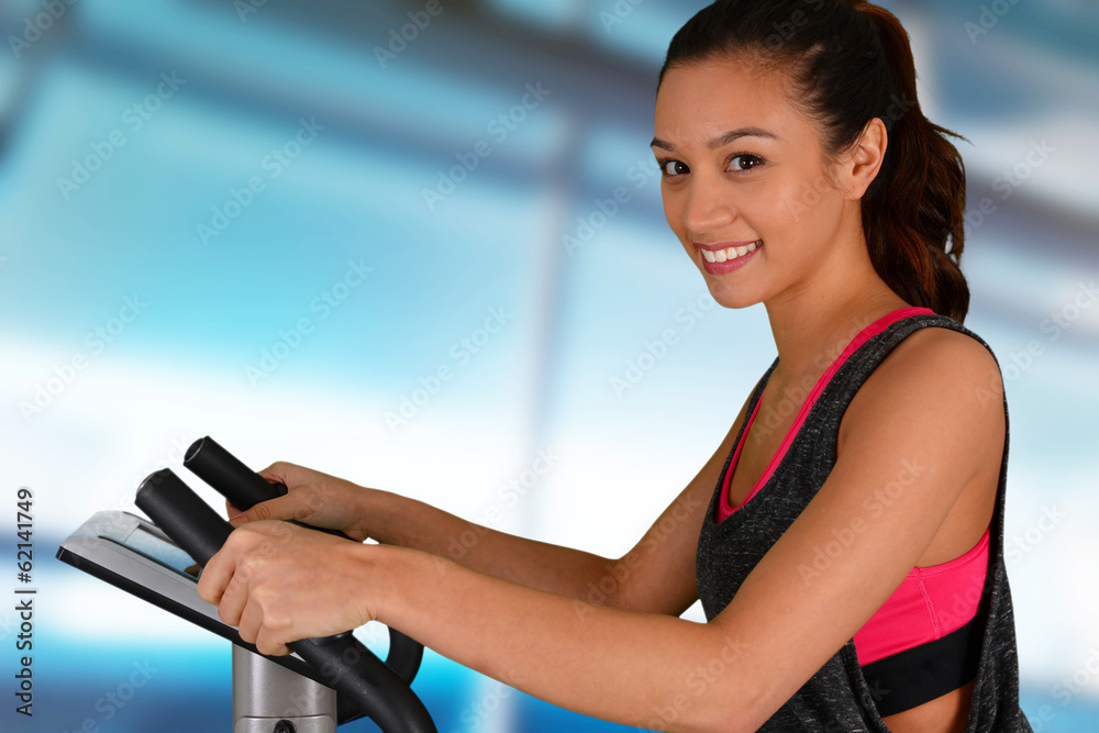 Woman Working Out On Bike
