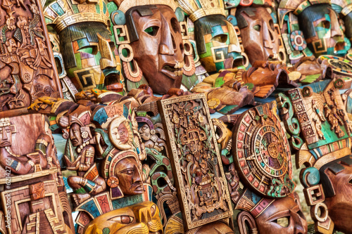 Mayan wooden handcrafted masks in a traditional Mexican market