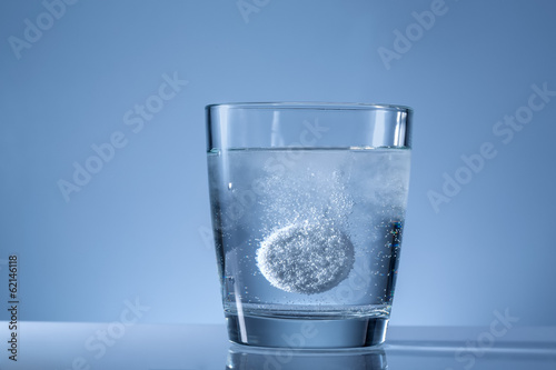 effervescent tablet in a glass of water