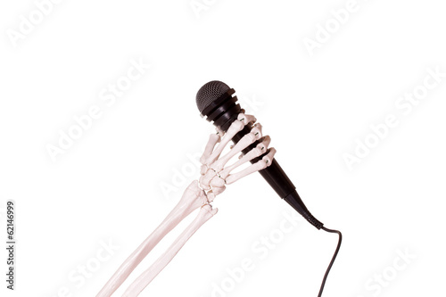 skeleton hand holding microphone