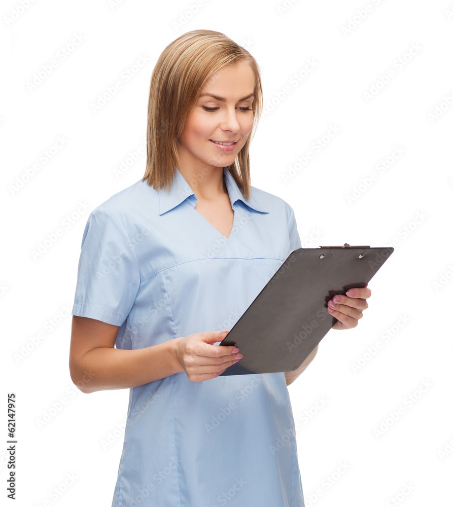 smiling female doctor or nurse with clipboard smiling female doctor or nurse with clipboard