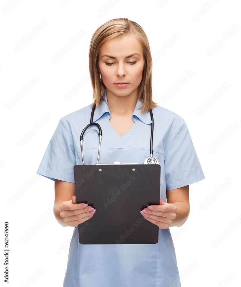 smiling female doctor or nurse with clipboard smiling female doctor or nurse with clipboard