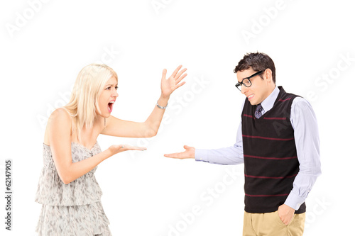 Young couple arguing isolated on white background