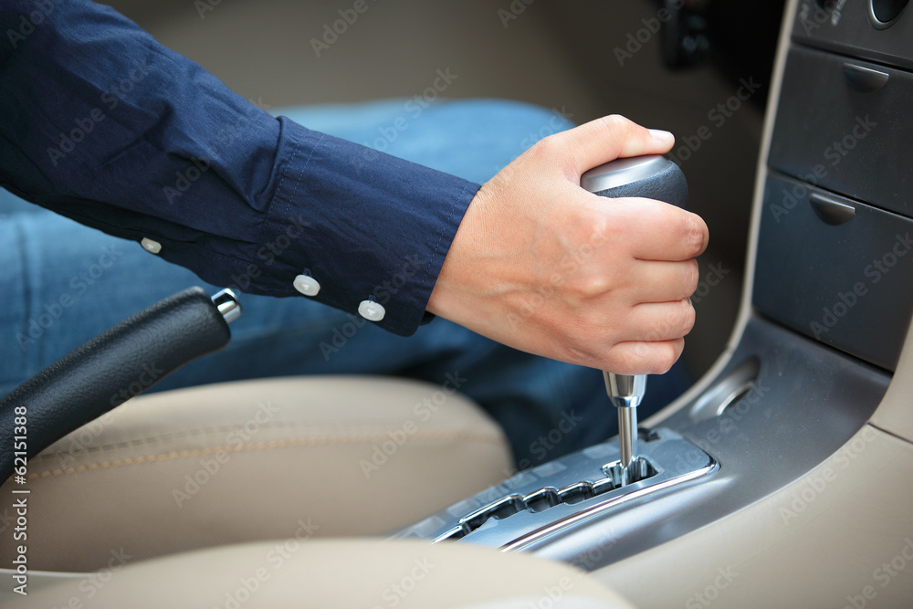 hand shifting the gear stick