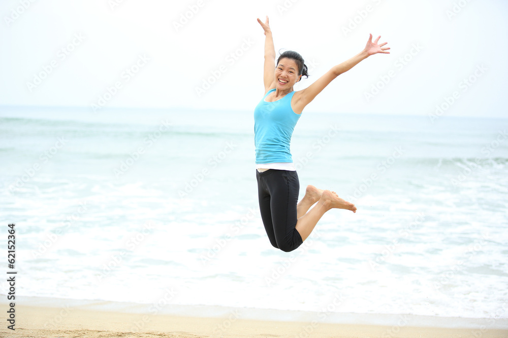 Happy woman jumping on the beach. summer holidays Happy woman jumping on the beach. summer holidays
