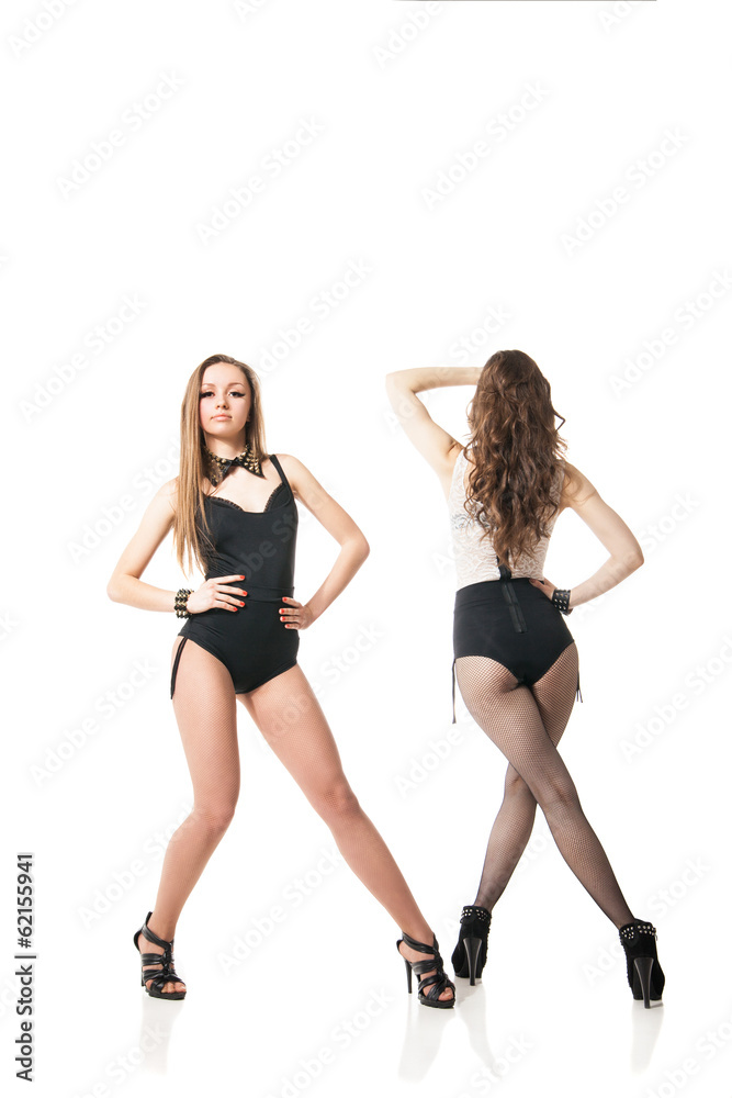 Go-go dancing women posing against white Go-go dancing women posing against white