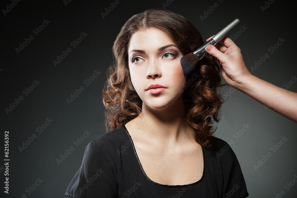 Obraz premium Make-up Applying closeup. Cosmetic Powder Brush
