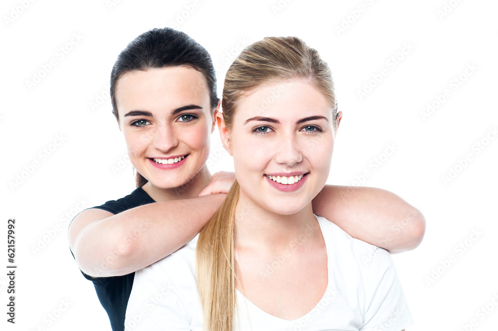 Attractive smiling teen girls facing camera Attractive smiling teen girls facing camera