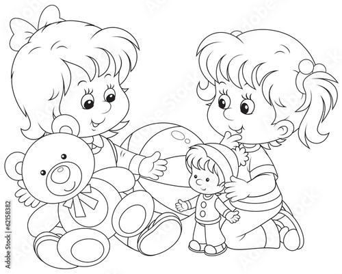 Little girls play with toys on the floor