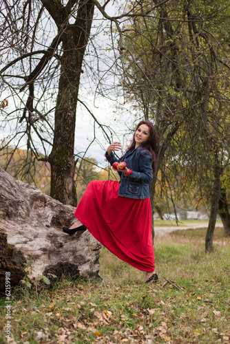 Young beautiful girl on a walk in the country