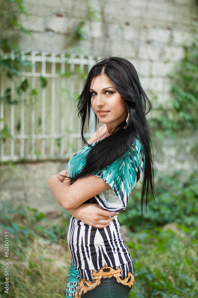 Fototapeta premium Young beautiful girl on a walk in the country