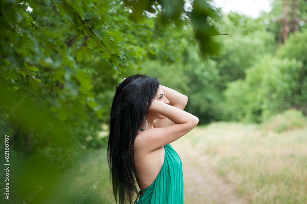 Young beautiful girl on a walk in the country