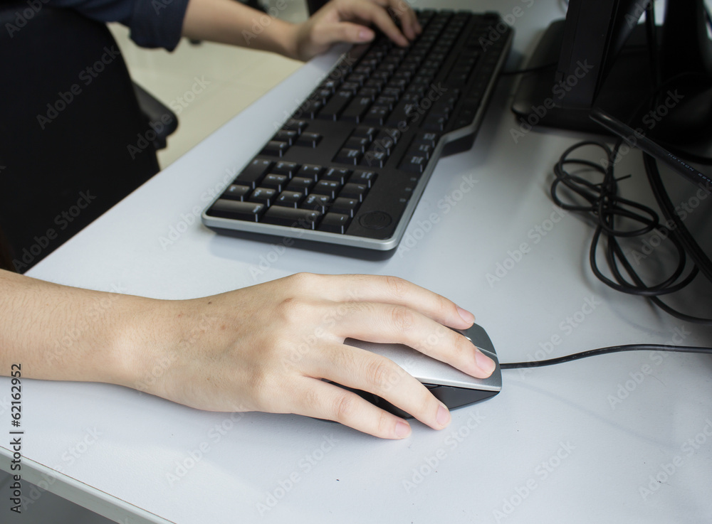 Image of female hands clicking computer mouse Image of female hands clicking computer mouse