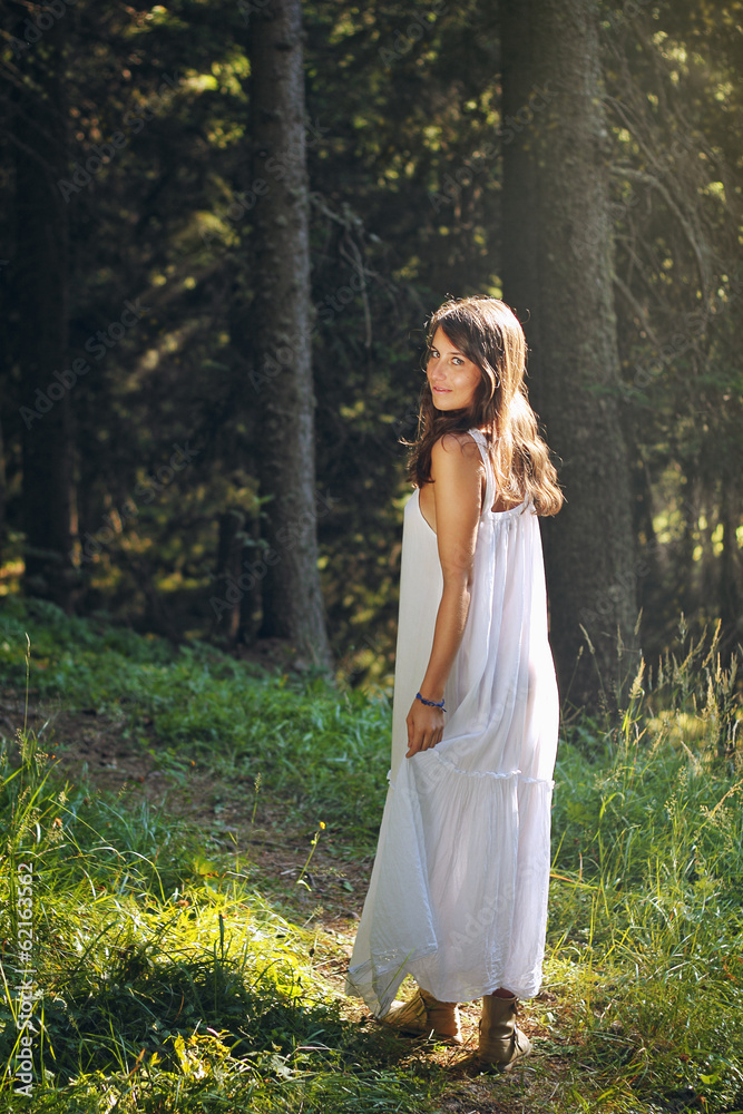 Beautiful and happy young woman in the forest Beautiful and happy young woman in the forest