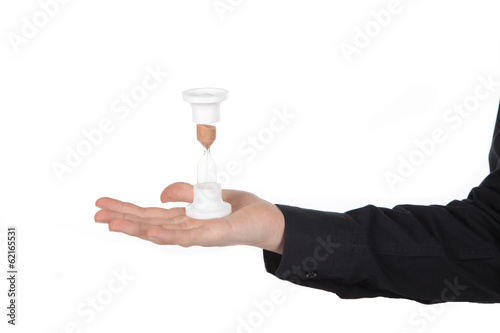 hourglass in male hand on a white background