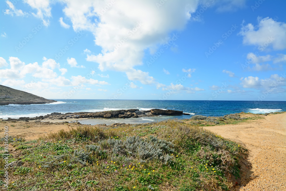 clouds over Argentiera rocky shore