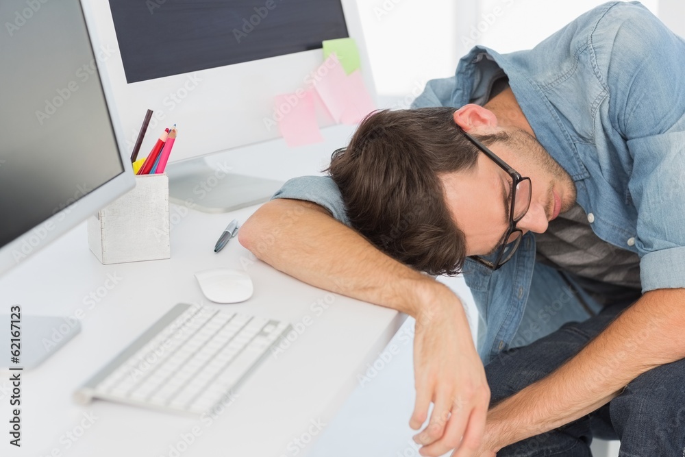 Young casual man sleeping in front of computer Young casual man sleeping in front of computer