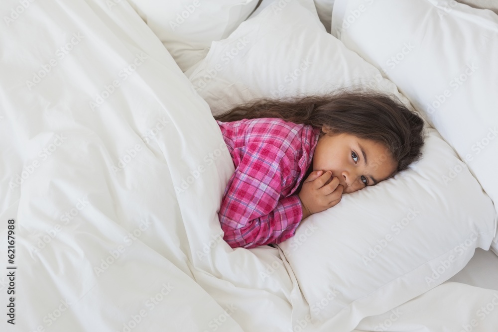 Portrait of a young girl resting in bed Portrait of a young girl resting in bed