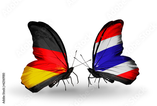 Two butterflies with flags Germany and Thailand