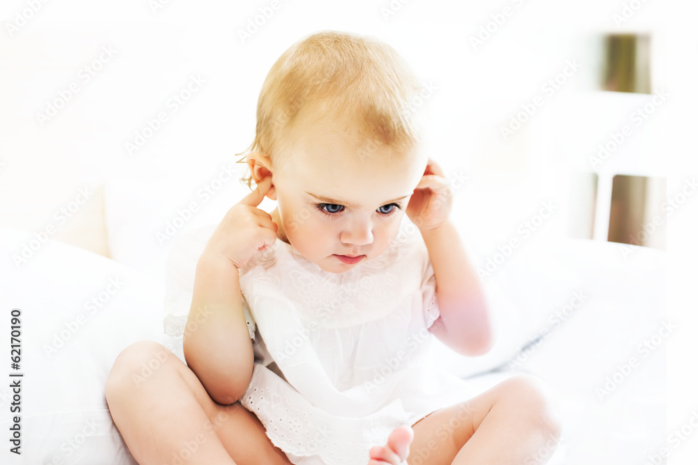 Baby closing her ears Baby closing her ears