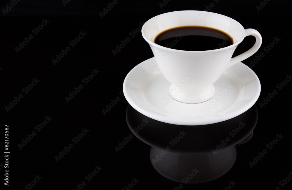 Coffee in a white cup over black background Coffee in a white cup over black background