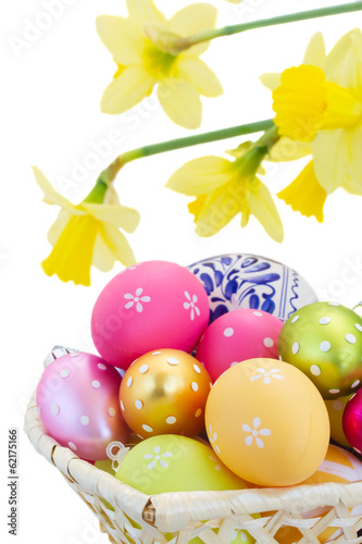 heap of easter eggs and daffodils