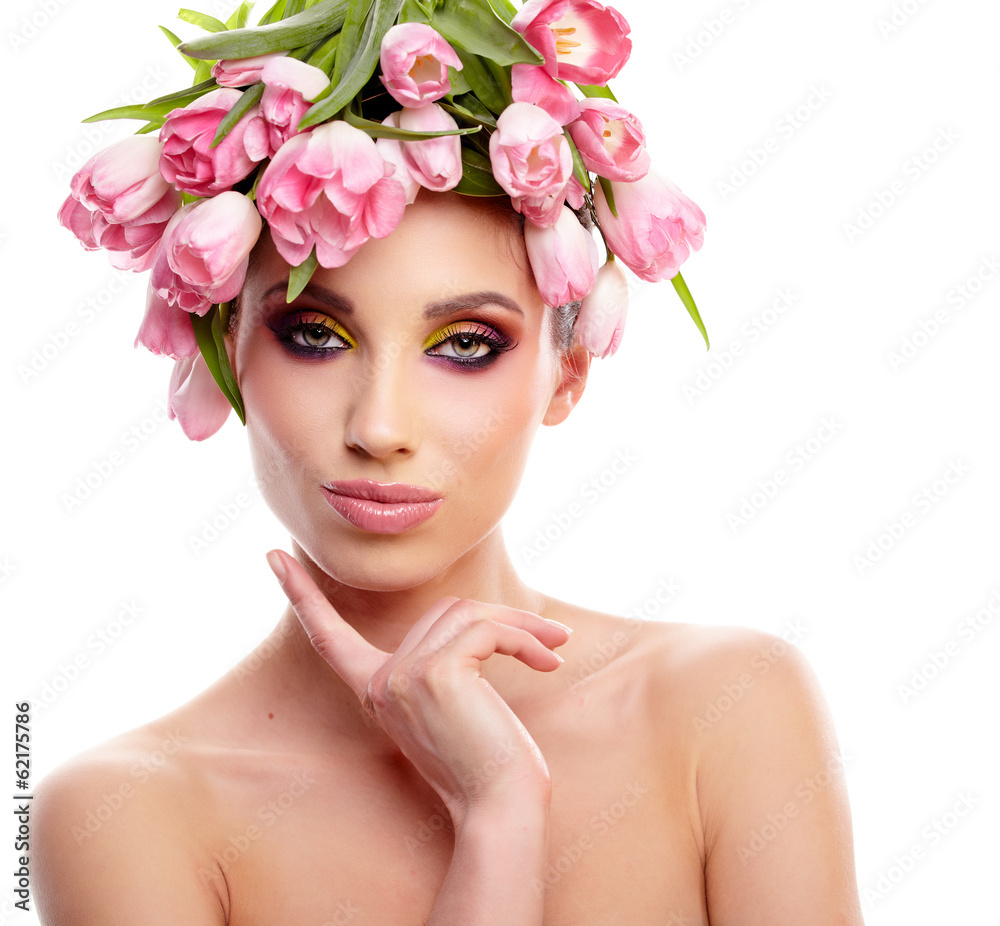 Portrait of a beautiful spring girl wearing flowers hat. Studio Portrait of a beautiful spring girl wearing flowers hat. Studio