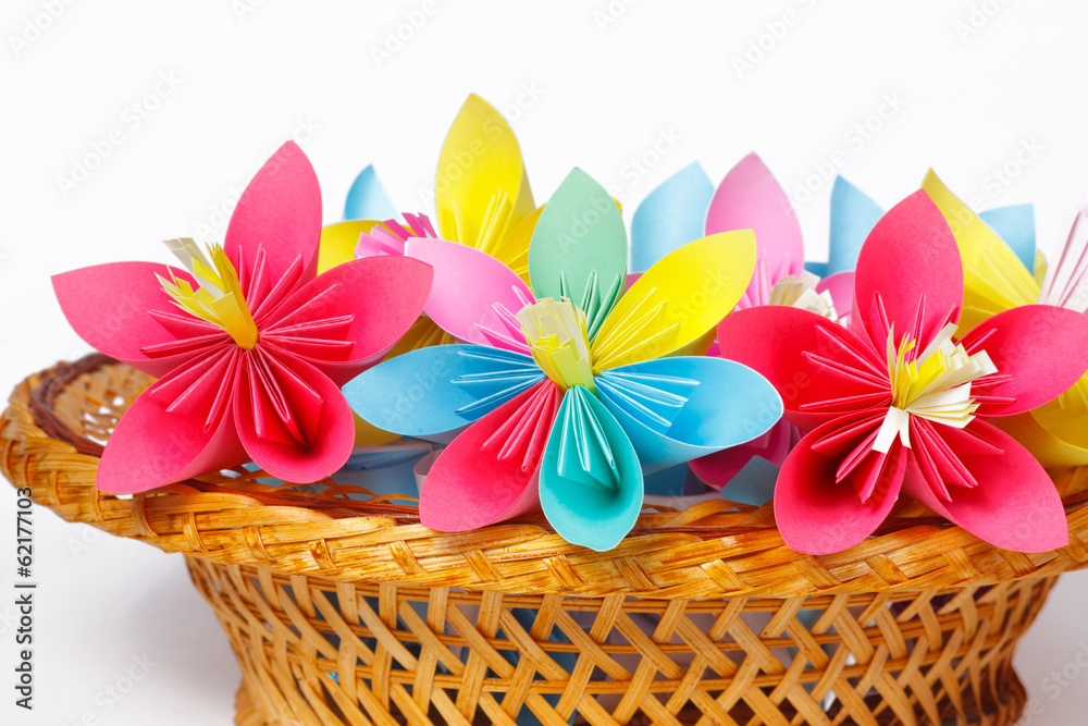 Many colored paper flowers in the basket Many colored paper flowers in the basket