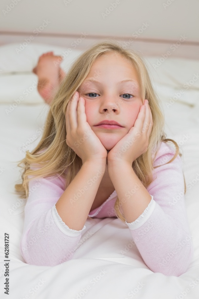 Portrait of a young girl resting in bed Portrait of a young girl resting in bed