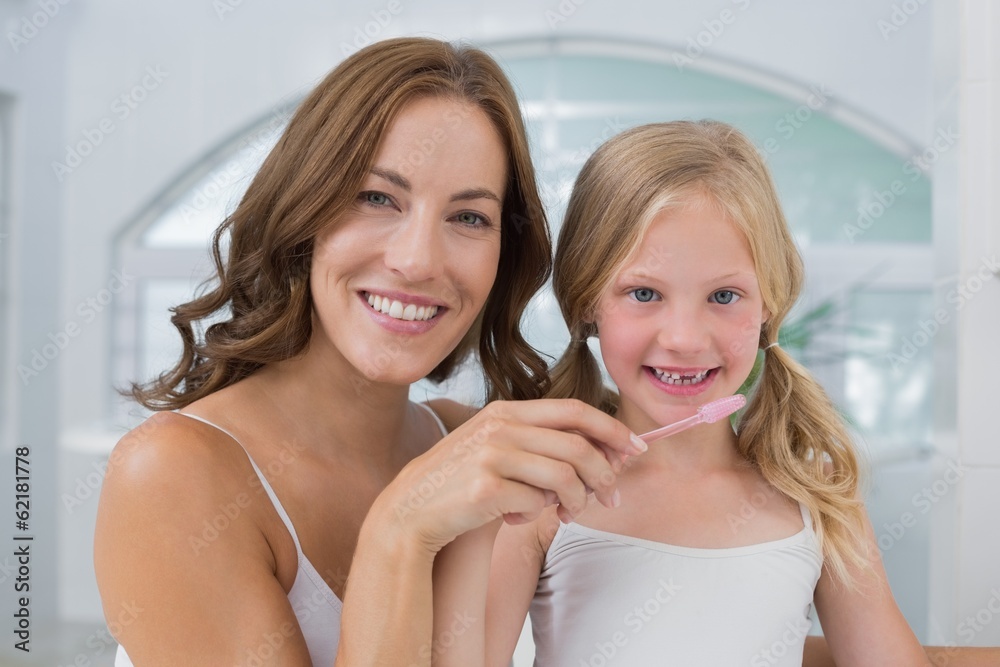 Close-up of mother with daughter brushing teeth Close-up of mother with daughter brushing teeth
