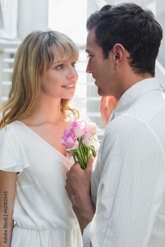 Loving young couple with flowers Loving young couple with flowers