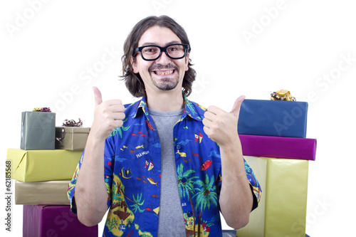young casual man holding gifts, isolated