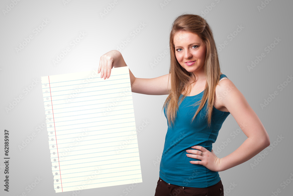 Young woman holding white paper copy space with diagonal lines Young woman holding white paper copy space with diagonal lines