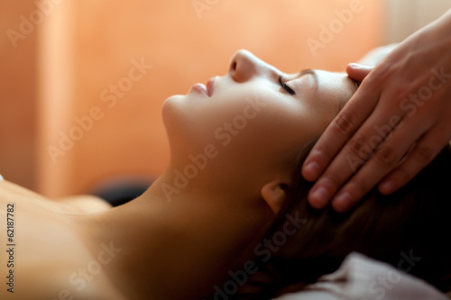 Woman receiving a head massage