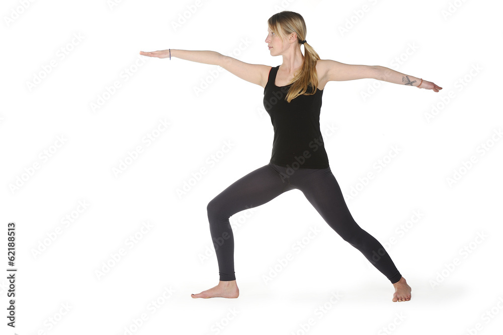 Beautiful young woman in great shape practicing yoga