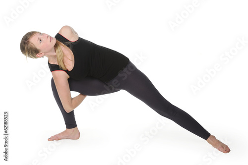 Beautiful young woman in great shape practicing yoga © krutenyuk