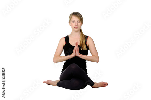 Beautiful young woman in great shape practicing yoga