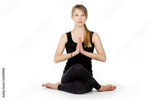 Beautiful young woman in great shape practicing yoga © krutenyuk