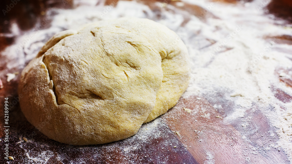 A bun of leavened dough in flour A bun of leavened dough in flour
