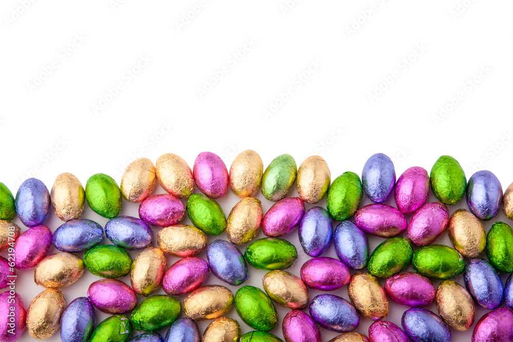 Fototapeta premium Mini chocolate eggs wrapped in colourful foil