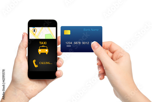 female hands holding phone with interface taxi and credit card o