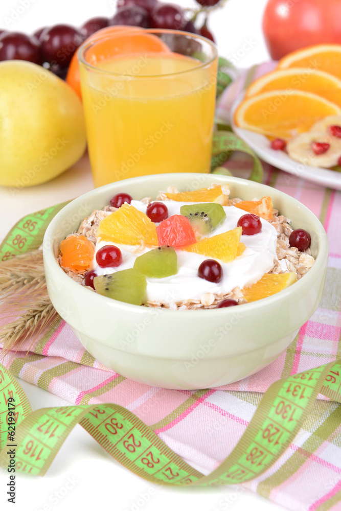 Delicious oatmeal with fruit in bowl on table close-up Delicious oatmeal with fruit in bowl on table close-up