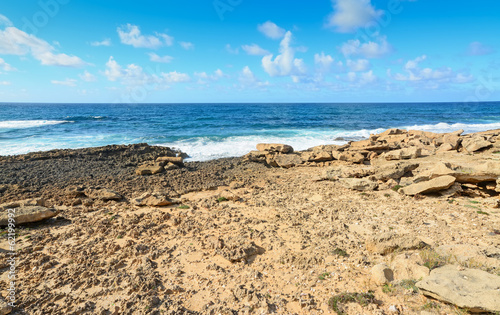 blue waves and yellow rocks