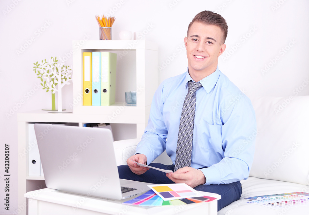 Young creative designer working at home Young creative designer working at home